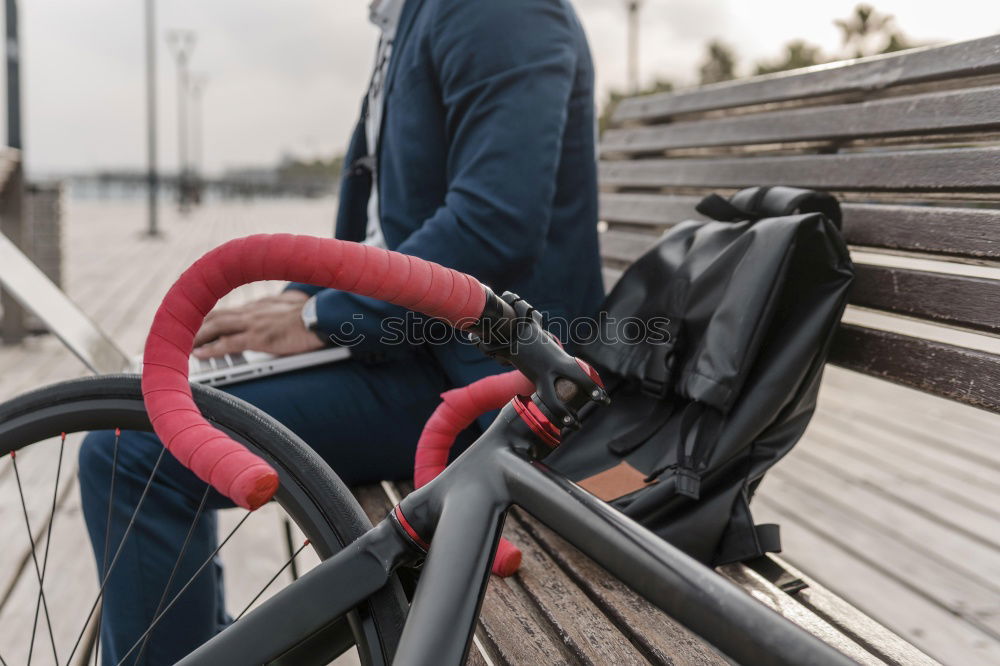 Similar – Mann mit Fahrrad auf Brücke stehend