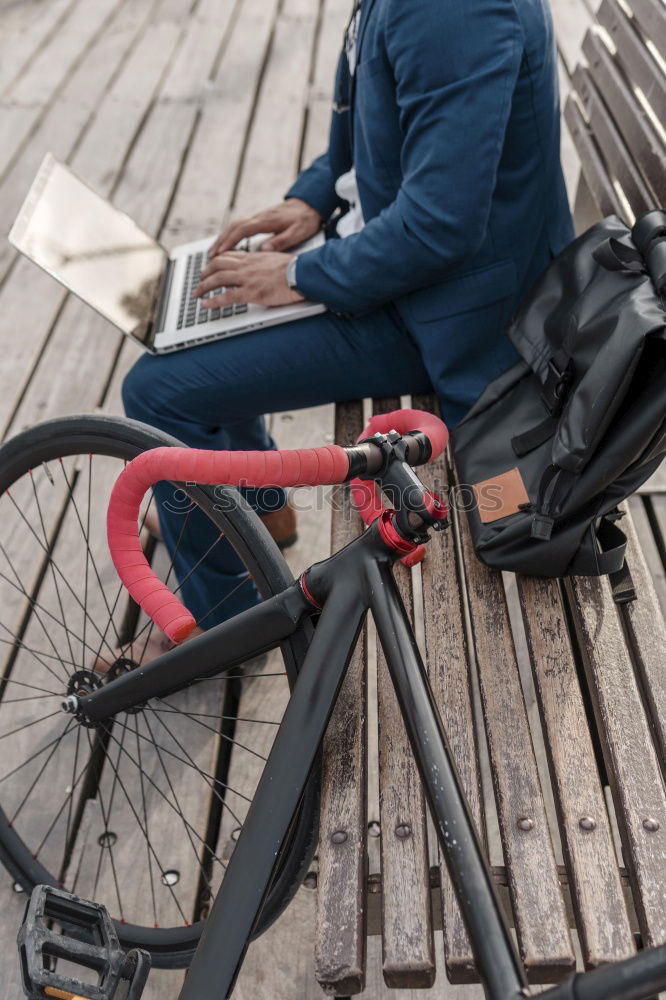 Similar – Mann mit Fahrrad auf Brücke stehend