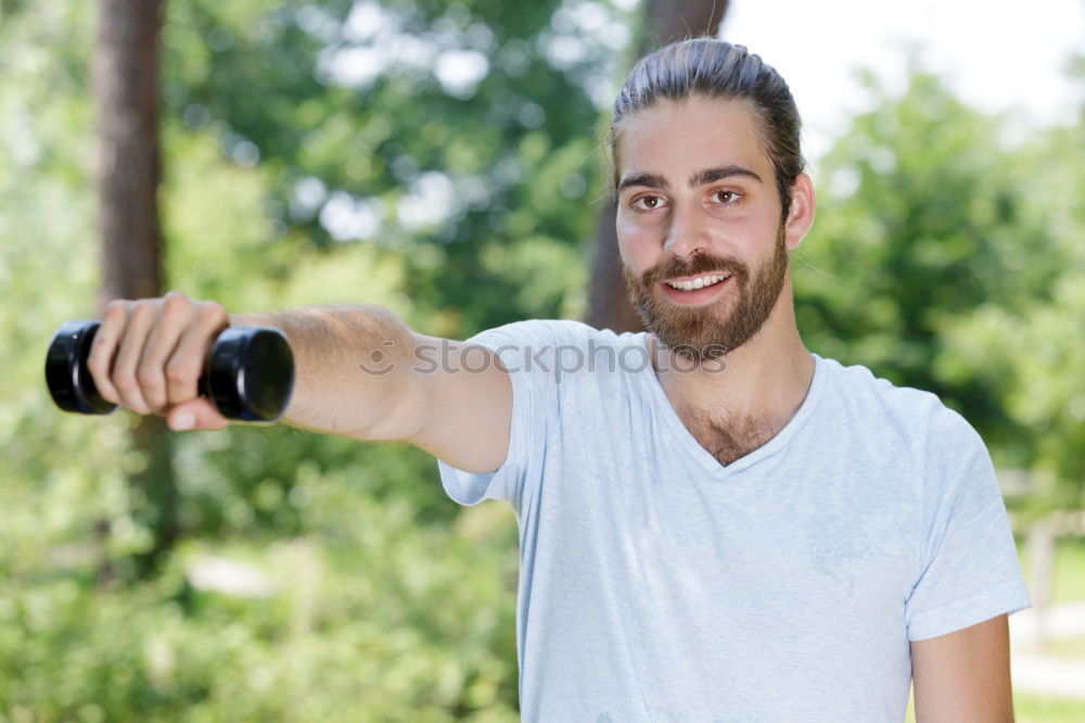 Similar – Image, Stock Photo Young man using smartphone sending emojis.