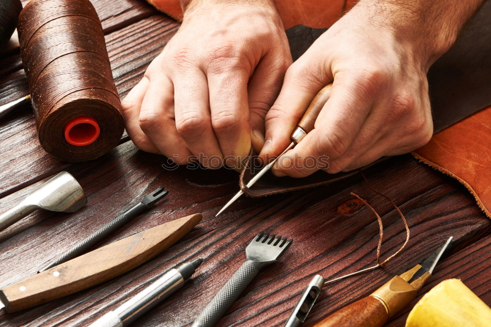 Similar – Hands making shoes