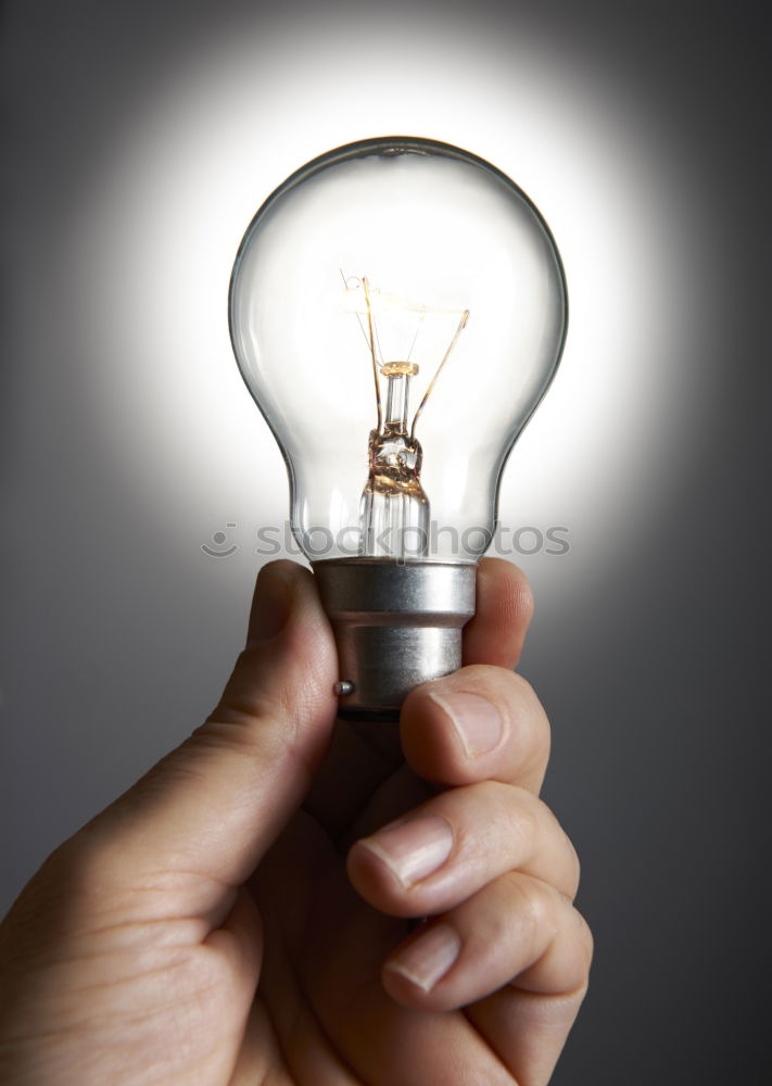 Similar – Female hand holding a shining light bulb, Great idea, innovation and inspiration, business concept background