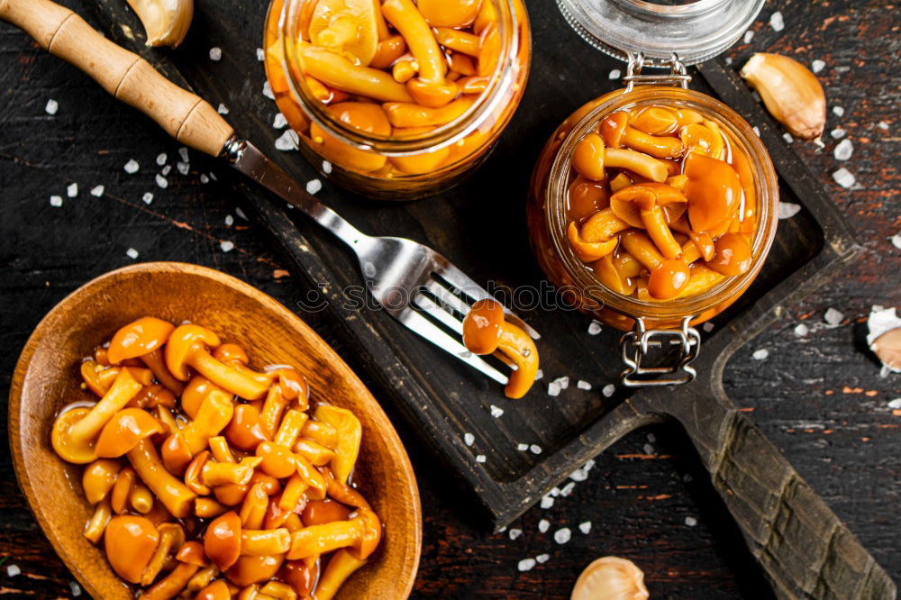 Similar – raw pasta fusilli on a brown wooden table