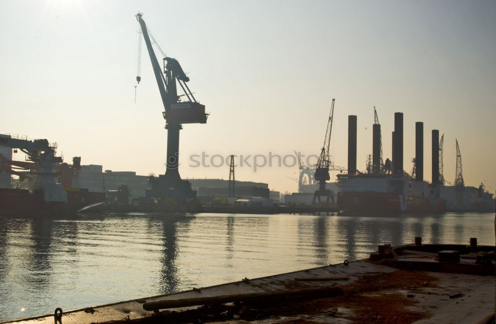 Similar – Pastel evening atmosphere at the harbor basin with cargo cranes