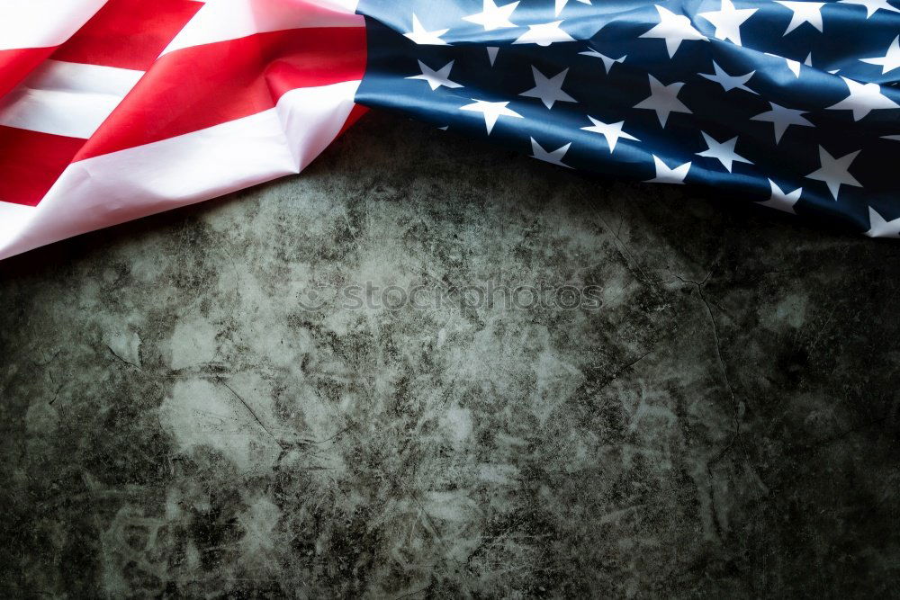 Similar – Man holds American flag in hand