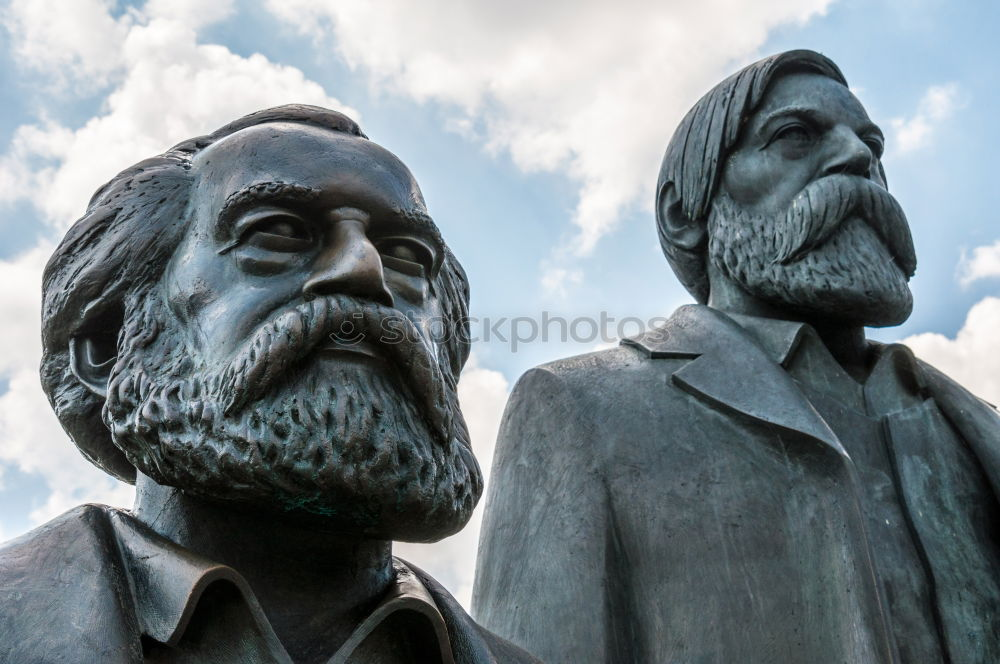 Similar – Image, Stock Photo male senior with silver-grey curls, glasses and three-day beard sitting in front of the Karl Marx monument in Chemitz