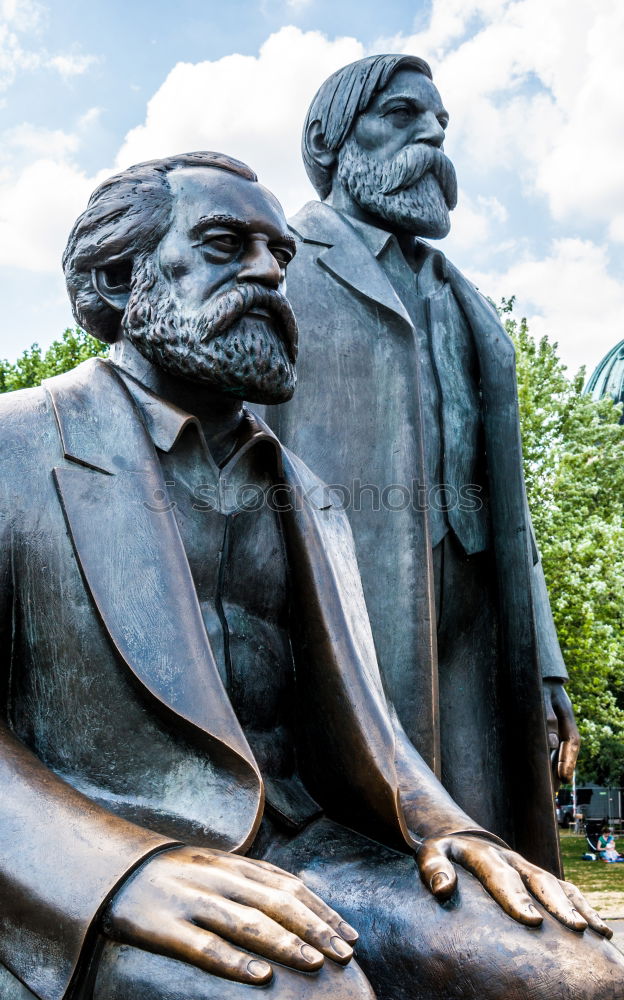 Similar – Image, Stock Photo male senior with silver-grey curls, glasses and three-day beard sitting in front of the Karl Marx monument in Chemitz