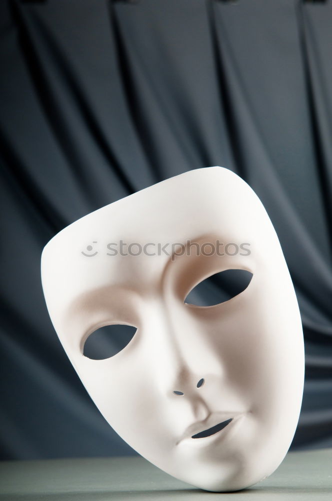 Similar – happy mature woman peeking from behind mask