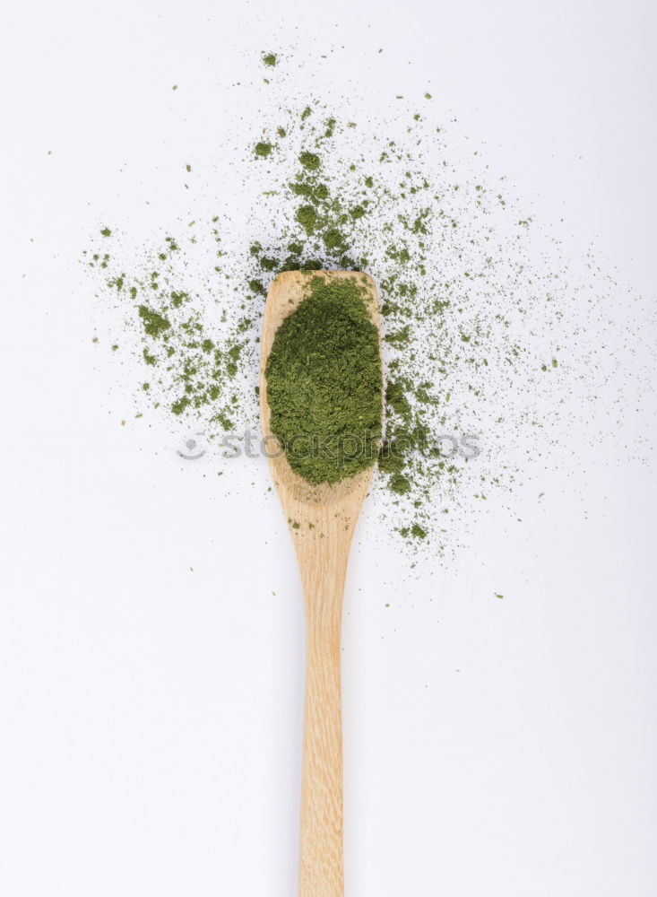 Green matcha tea powder and bamboo whisk