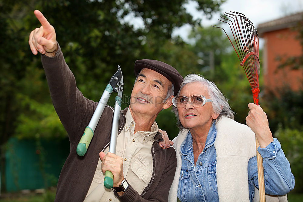 Similar – Image, Stock Photo Portrait of two laughing seniors, one with silver-grey curls and glasses, the other with cap in front of an old wall