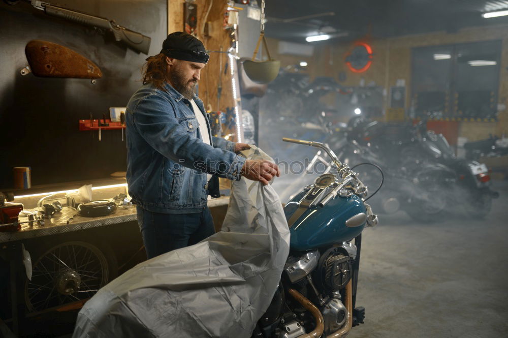Similar – Image, Stock Photo Mechanic checking motorcycle