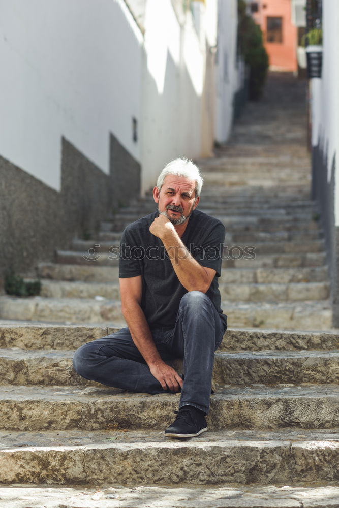 Similar – Image, Stock Photo Mature man sitting on steps in the street.