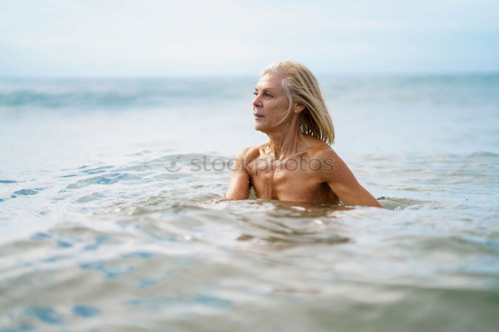 Similar – Foto Bild Reife Frau in guter Form beim Baden im Meer.