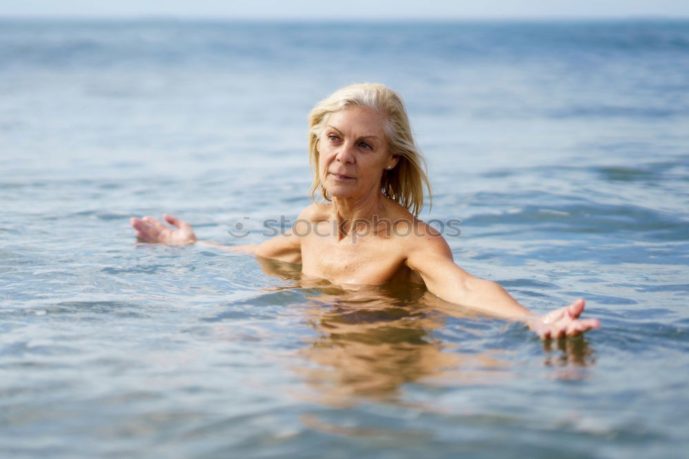 Similar – Foto Bild Reife Frau in guter Form beim Baden im Meer.