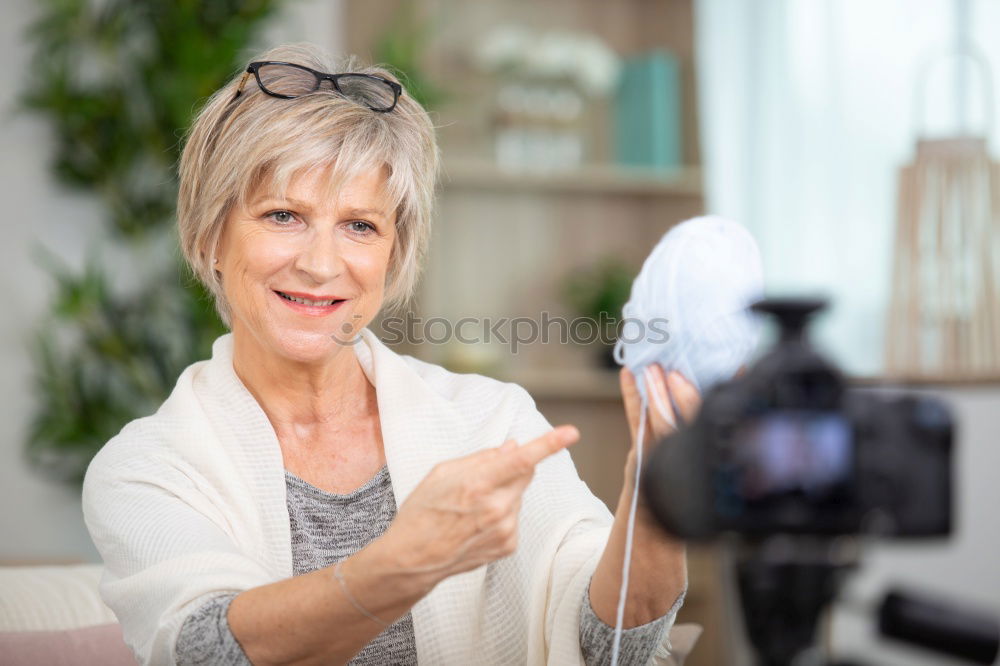 Similar – Image, Stock Photo Portrait of woman knitting a wool sweater