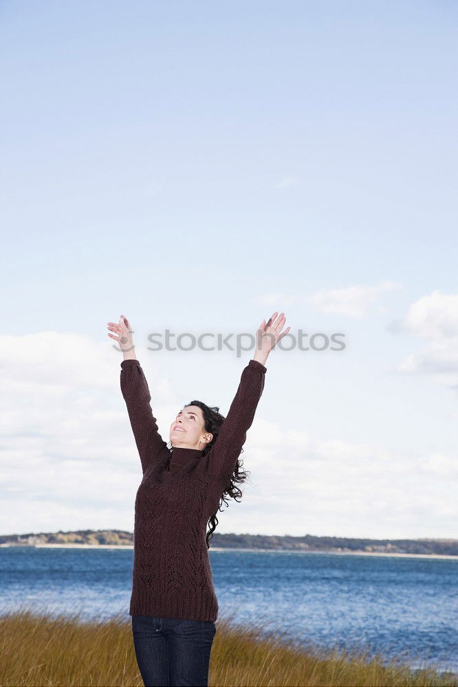 Similar – Image, Stock Photo Woman with wind ruffled hair looks up