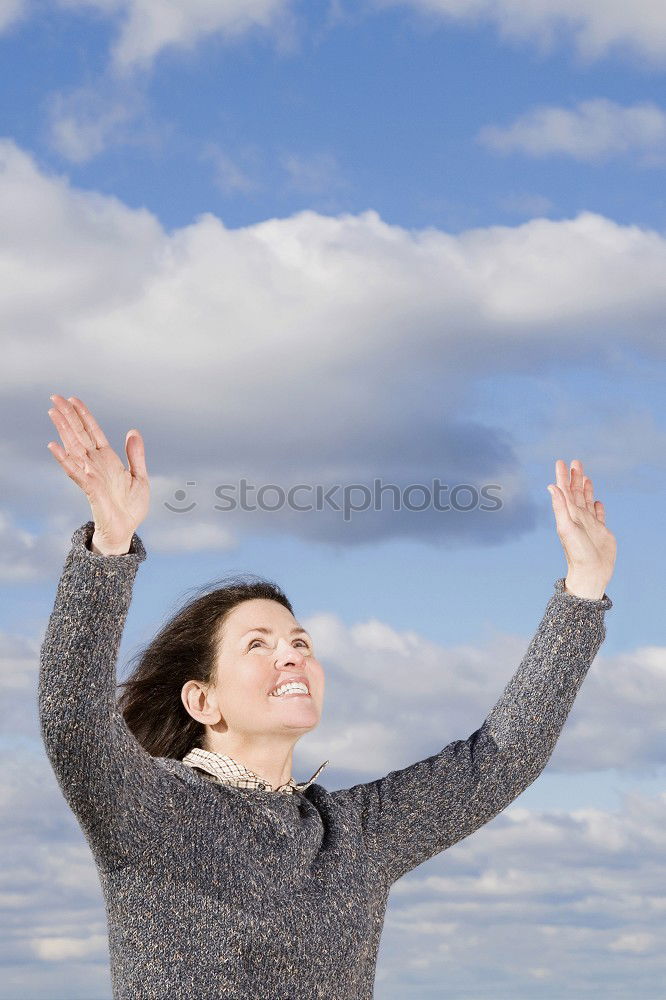 Similar – Image, Stock Photo A woman with a red cap stands in front of a wind turbine. Climate change. Alternative power generation. Renewable energy