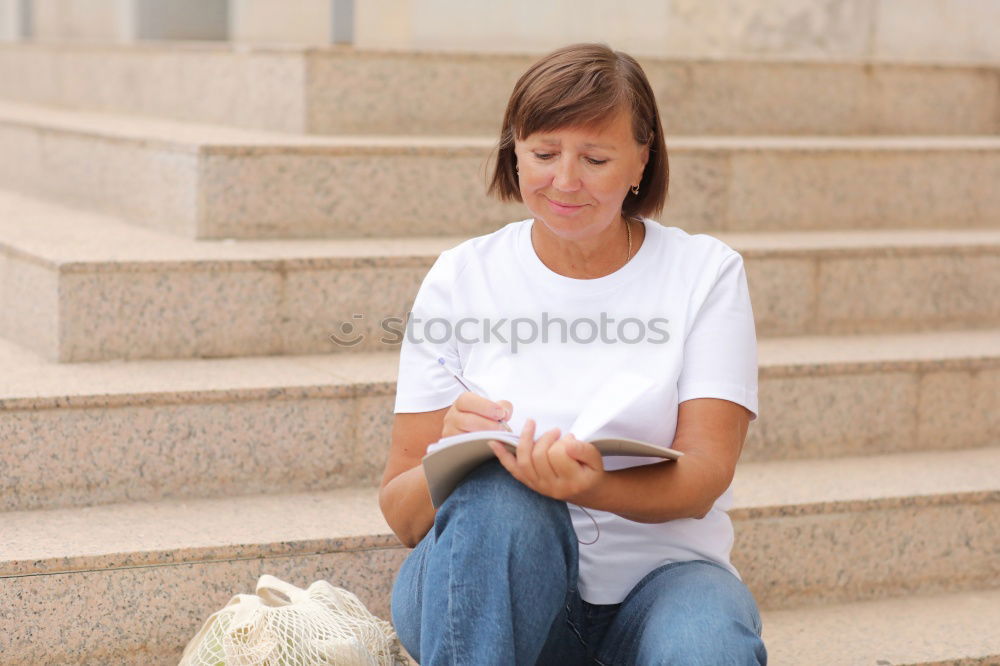 Similar – Image, Stock Photo Young woman sitting reading on urban steps