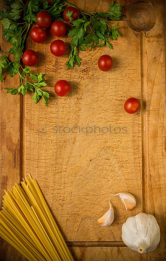 Similar – Image, Stock Photo cutting board with a knife and fresh red cherry tomatoes