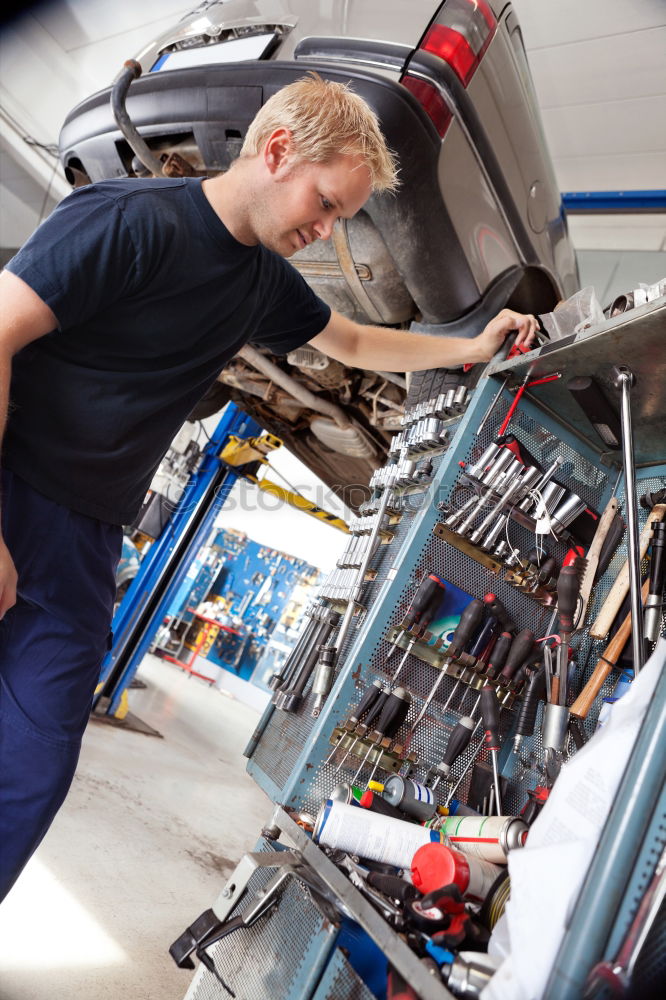 Similar – Image, Stock Photo Mechanic cleaning a motorcycle
