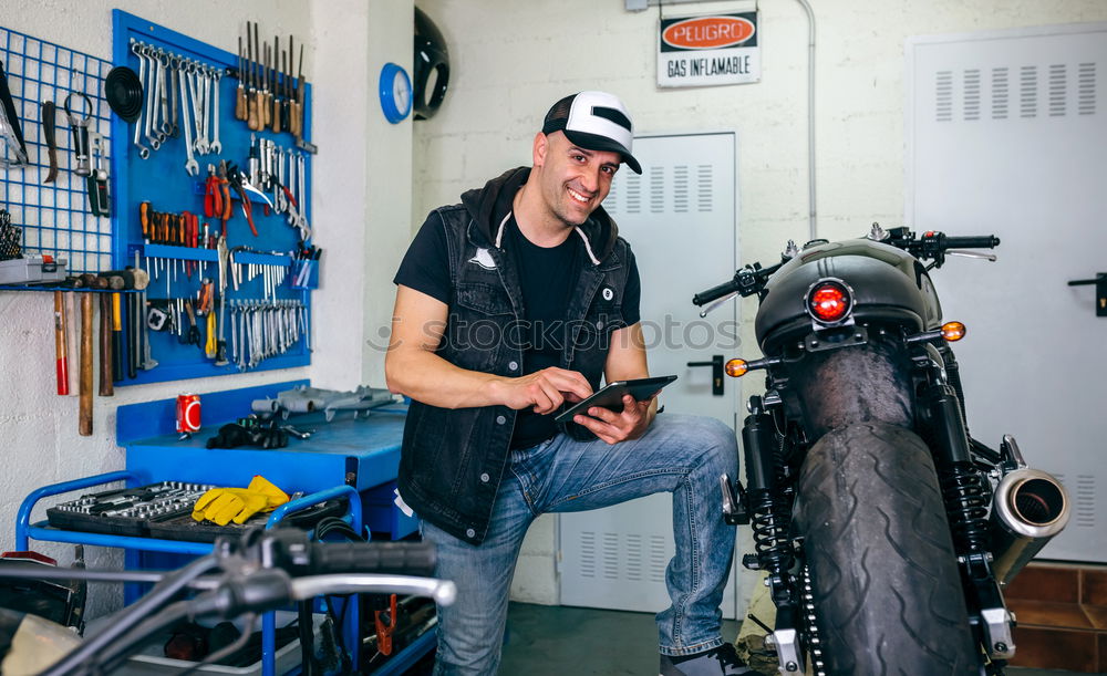 Similar – Image, Stock Photo Mechanic checking motorcycle