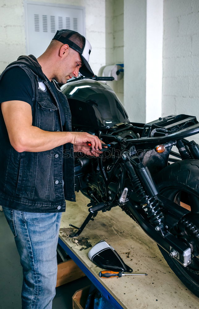 Similar – Image, Stock Photo Mechanic checking motorcycle