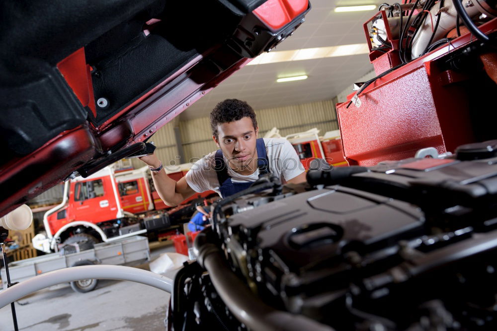 Similar – Man working on bike in shop