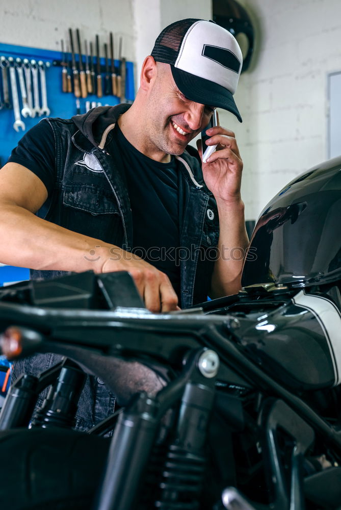 Image, Stock Photo Mechanic checking motorcycle