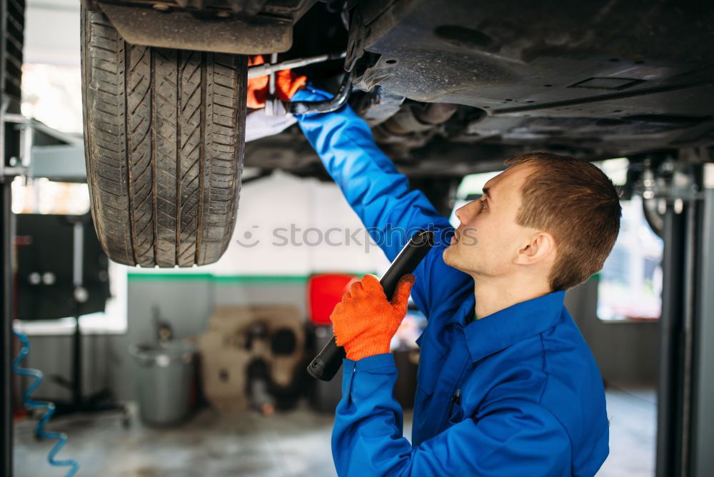 Similar – Professional Car Mechanic working.