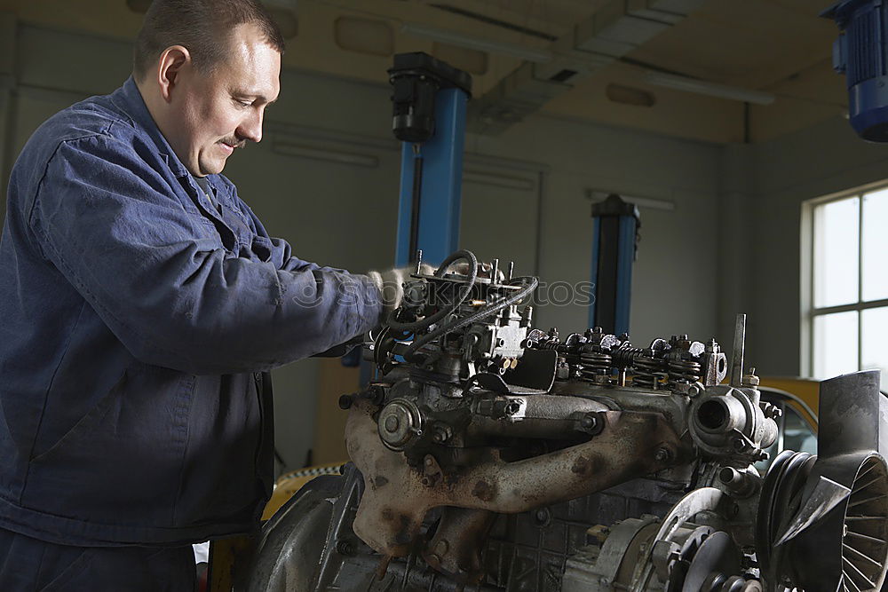 Similar – Man working on bike in shop