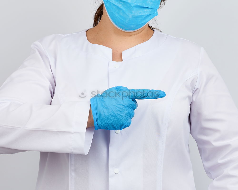 Similar – portrait of doctor woman wearing protective mask and gloves indoors. Using mobile phone. Corona virus concept