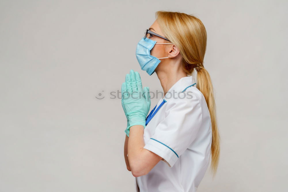 Similar – Image, Stock Photo Nurse with mouth guard examines laboratory sample