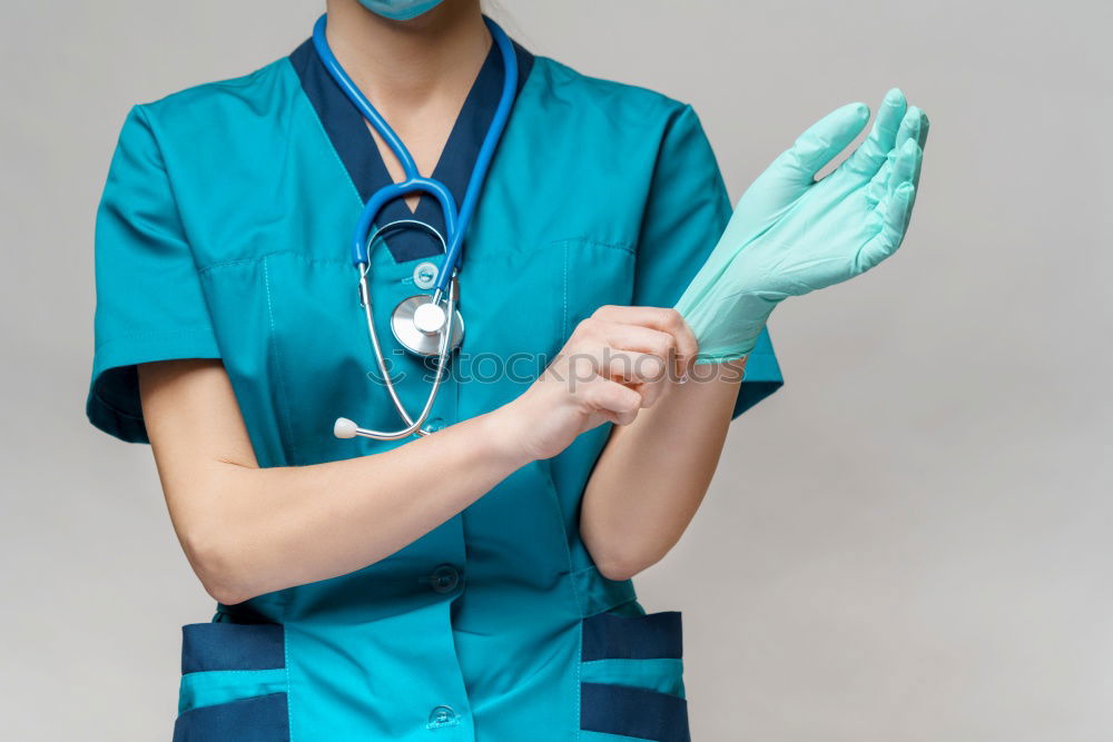 Similar – Image, Stock Photo Female therapist in white robe tying bandana of medical uniform