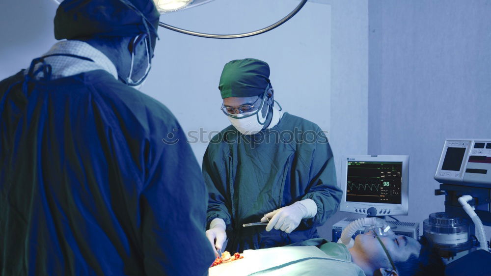 Similar – Image, Stock Photo Team of Surgeons Operating.