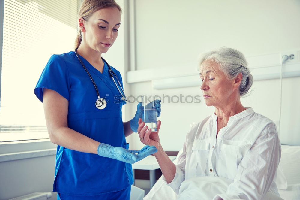 Similar – Doctor holding syringe with vaccine and making injection to senior patient. Covid-19 or coronavirus vaccine