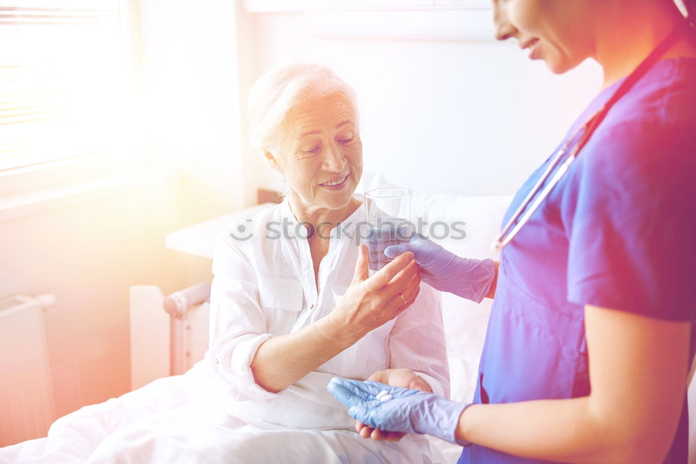 Similar – Doctor holding syringe with vaccine and making injection to senior patient. Covid-19 or coronavirus vaccine