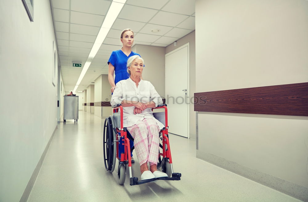 Similar – Senior woman sitting in wheelchair in hospital