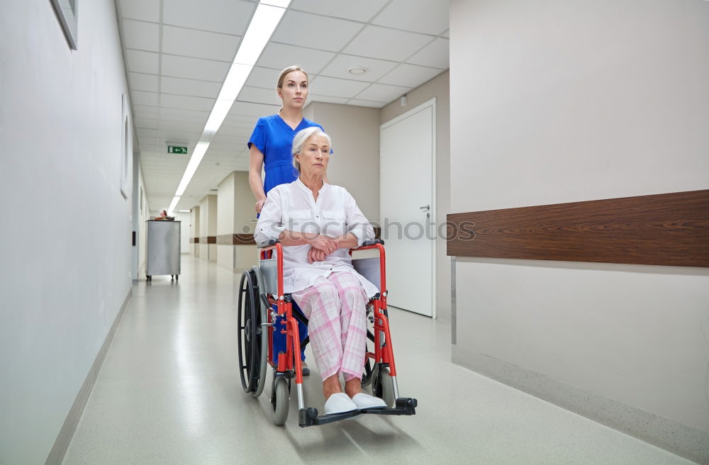 Similar – Senior woman sitting in wheelchair in hospital