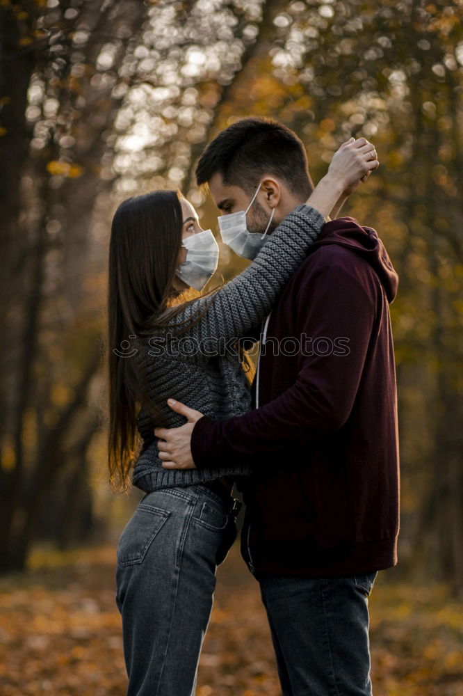 Couple embracing on evening street