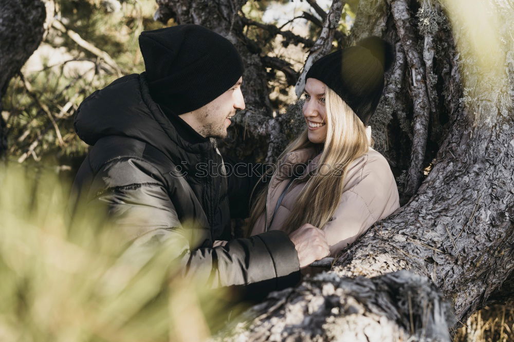 Similar – Image, Stock Photo Happy couple hugging and kissing near tree in park