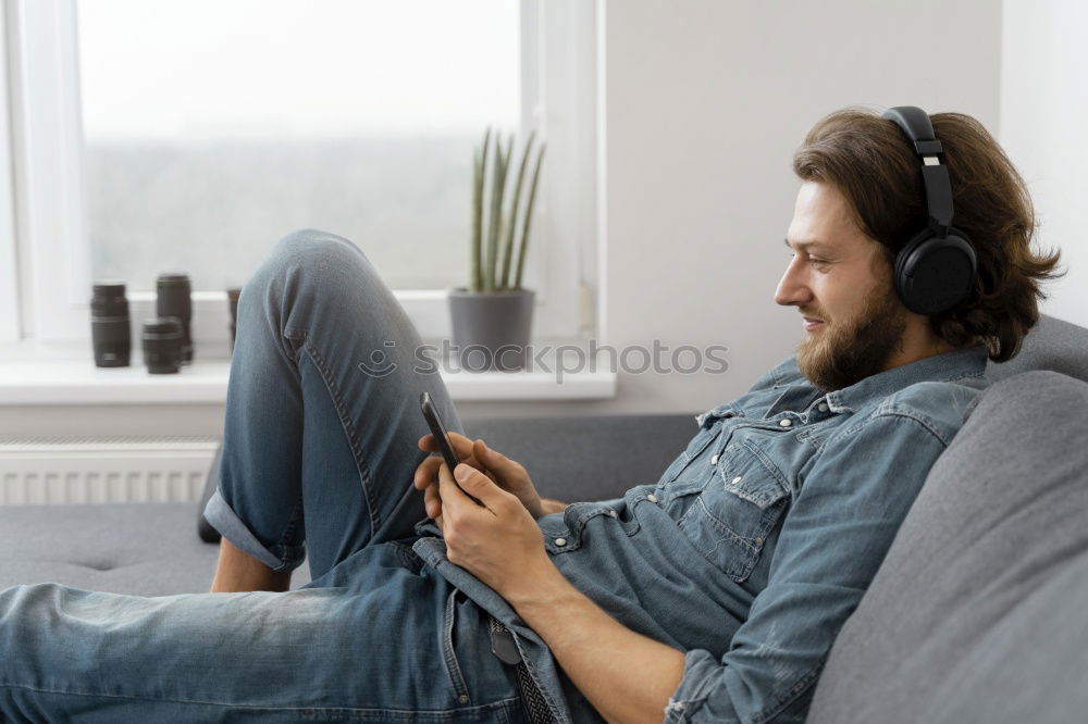 Similar – Man listening music in train