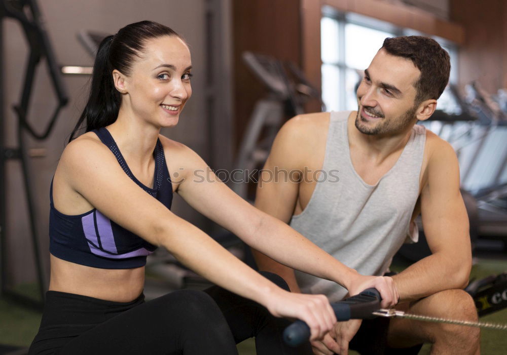 Similar – Image, Stock Photo Man and woman personal trainers in the gym.