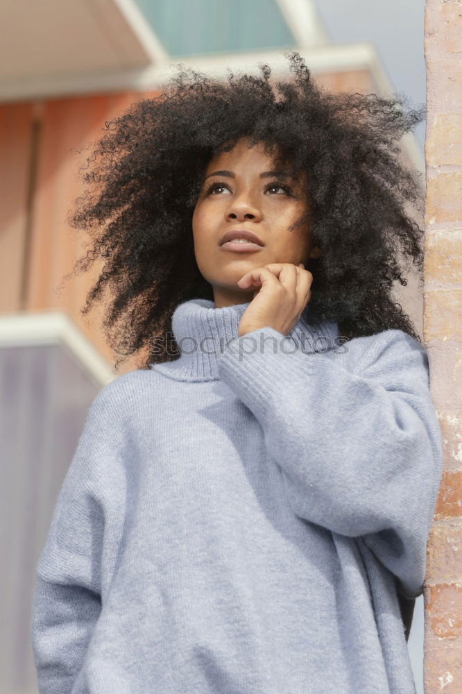 Similar – Portrait of young african woman stretching out tongue