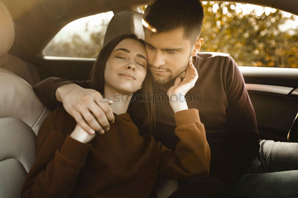 Similar – Young couple kissing through of glass car