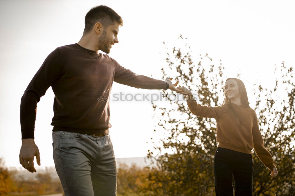 Similar – Image, Stock Photo Young woman holding hand of man and leading by a meadow