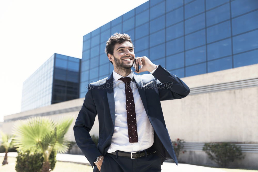 Similar – Image, Stock Photo Elegant Young Businessman in the Street Using a Mobile Phone