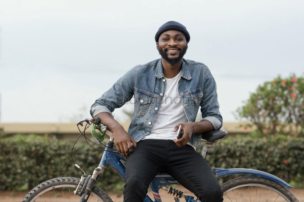 Similar – Young modern man sitting on halfpipe taking picture with Camera