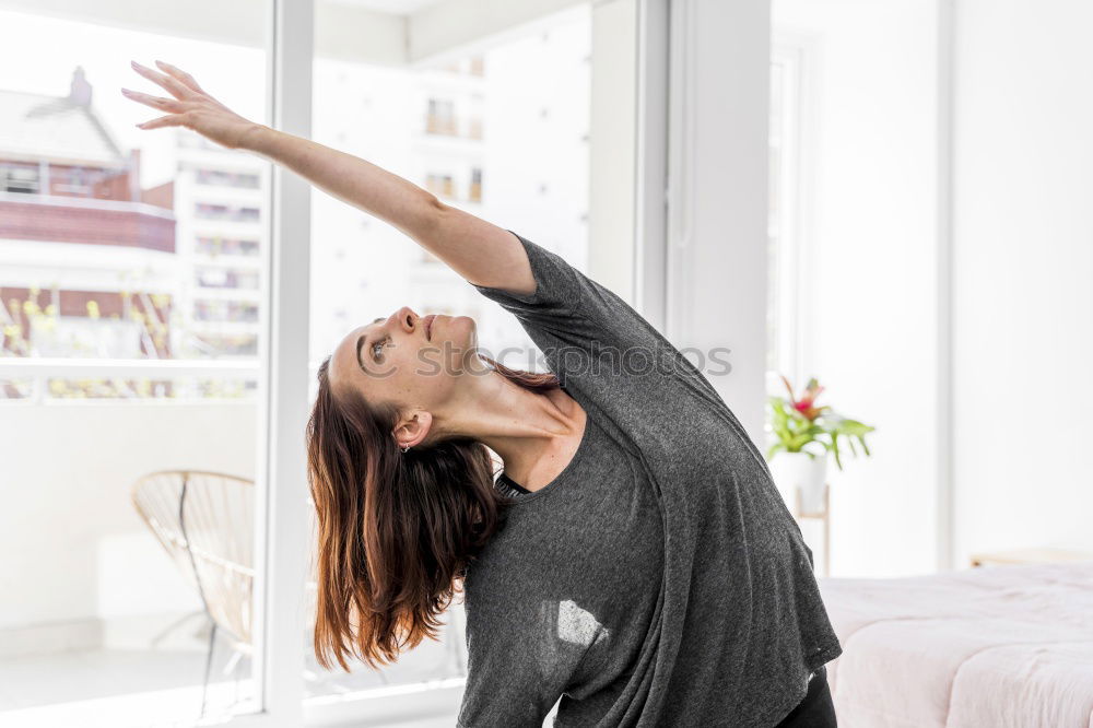 Similar – Woman stretching in bed