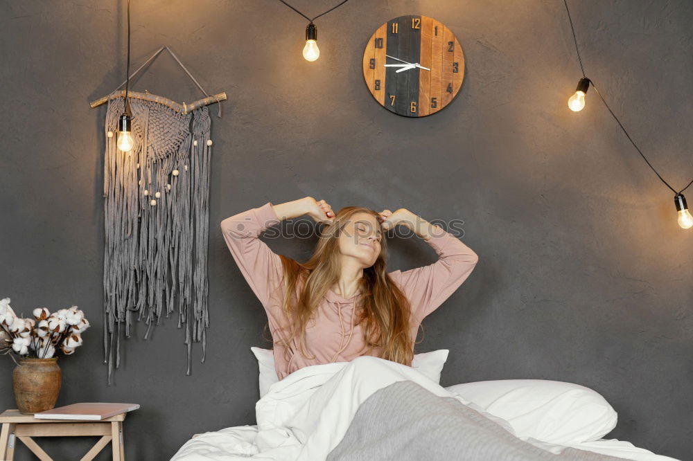 Similar – happy kid girl waking up in early morning in her room, lying in bed