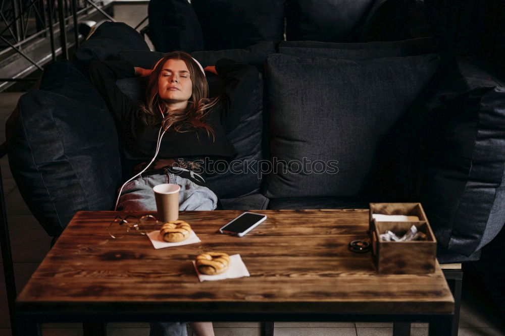 Similar – Woman sitting on kitchen table