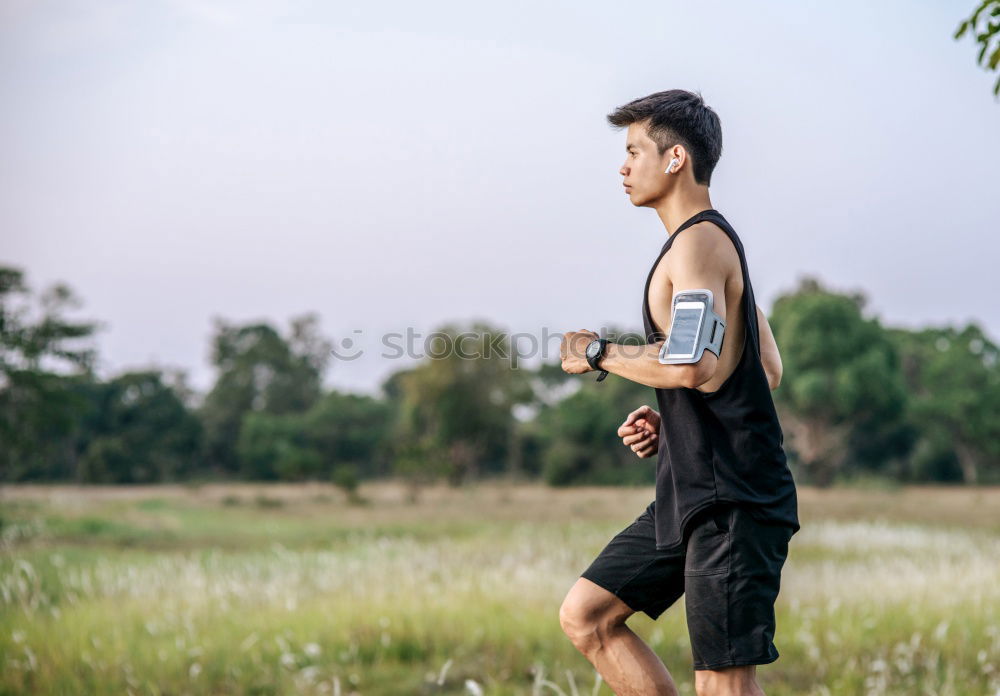 Similar – Young sports man is running up the stairs for his workout